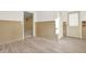 Bright living room with modern wood-look tile flooring, and a door to the exterior at 4963 Kingsbridge Ct, Powder Springs, GA 30127