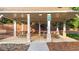 Community picnic shelter with picnic tables, supporting columns, and a concrete foundation at 4963 Kingsbridge Ct, Powder Springs, GA 30127