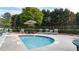 Relaxing hot tub area with comfortable chairs and shaded seating at 4963 Kingsbridge Ct, Powder Springs, GA 30127