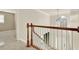 Staircase landing showcasing the home's elegant design and access to different areas of the house at 4963 Kingsbridge Ct, Powder Springs, GA 30127