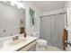 Clean bathroom with a shower, toilet, sink and vanity at 5999 Brookside Se Ln, Mableton, GA 30126