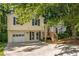 Charming two-story home with a front yard and garage at 5999 Brookside Se Ln, Mableton, GA 30126