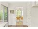 Bright hallway with views to the dining room and screened in back porch from the kitchen at 5999 Brookside Se Ln, Mableton, GA 30126