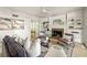 Bright living room with a fireplace, built-in shelving and inviting dining area at 5999 Brookside Se Ln, Mableton, GA 30126