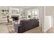 Cozy living room with large windows, fireplace, and built-in bookshelves at 5999 Brookside Se Ln, Mableton, GA 30126