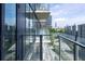 Condo balcony featuring glass railings with a view of the city skyline at 788 W Marietta Nw St # 311, Atlanta, GA 30318