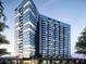 Stunning exterior view of a modern high-rise building with glass facade and multiple balconies at 788 W Marietta Nw St # 311, Atlanta, GA 30318