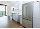 Well-appointed kitchen boasts stainless steel appliances, sleek cabinets, and hardwood flooring throughout the space at 788 W Marietta Nw St # 311, Atlanta, GA 30318