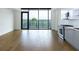 Modern kitchen showcases stainless steel appliances, light gray cabinets and a large window with a view at 788 W Marietta Nw St # 311, Atlanta, GA 30318