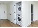 Hallway featuring a new stacked washer and dryer in an enclosed space at 788 W Marietta Nw St # 311, Atlanta, GA 30318