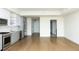 Bright open-concept living area featuring modern finishes and an adjacent doorway and bathroom entrance at 788 W Marietta Nw St # 311, Atlanta, GA 30318