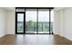 Bright living room with hardwood floors and a large window overlooking the trees at 788 W Marietta Nw St # 311, Atlanta, GA 30318