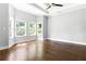 Large bedroom with hardwood floors, lots of natural light, and windows overlooking a treed yard at 1364 Westboro Sw Dr, Atlanta, GA 30310