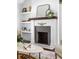 Cozy living room with brick fireplace and decorative mantel at 1364 Westboro Sw Dr, Atlanta, GA 30310