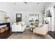 Inviting living room with white sofa and chairs on dark hardwood floors at 1364 Westboro Sw Dr, Atlanta, GA 30310