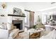 Bright living room with fireplace, mantel, and decorative sliding barn door at 1364 Westboro Sw Dr, Atlanta, GA 30310