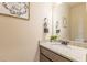Half bathroom featuring granite countertops, modern sink fixtures, and decorative wall art at 171 Osier Dr, Mcdonough, GA 30252