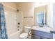 Bathroom featuring a toilet, a granite countertop sink, and a shower with curtain at 171 Osier Dr, Mcdonough, GA 30252