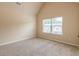 Bedroom showing window view of the neighborhood, plush carpeting, and natural light at 171 Osier Dr, Mcdonough, GA 30252