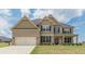 Charming two-story home with a brick and siding exterior and a well-manicured lawn at 171 Osier Dr, Mcdonough, GA 30252