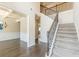Staircase in the foyer leads to an upstairs and a view of the living room at 171 Osier Dr, Mcdonough, GA 30252