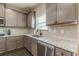 Kitchen featuring stainless steel appliances, tile backsplash, granite countertops, and modern fixtures at 171 Osier Dr, Mcdonough, GA 30252