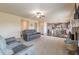 Open-concept living room showcasing neutral tones, comfortable seating, and seamless transition to the kitchen area at 171 Osier Dr, Mcdonough, GA 30252