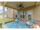 Covered patio with ceiling fan and comfortable seating, perfect for outdoor relaxation at 171 Osier Dr, Mcdonough, GA 30252