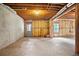 Partially insulated basement with a door and window awaiting customization at 180 Mirramont Lake Dr, Woodstock, GA 30189