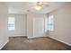 Bedroom with neutral walls and plush carpet, lots of sunlight at 180 Mirramont Lake Dr, Woodstock, GA 30189