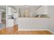 Kitchen with white cabinets and wooden bar top at 180 Mirramont Lake Dr, Woodstock, GA 30189