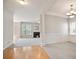 Open living room with lots of light, wood and carpet flooring, and neutral paint at 180 Mirramont Lake Dr, Woodstock, GA 30189