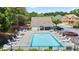 Community pool and clubhouse with ample lounge seating perfect for relaxing on warm days at 180 Mirramont Lake Dr, Woodstock, GA 30189