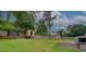 Expansive backyard with a trampoline, playhouse, storage shed, and ample green space at 2324 Ithica Se Dr, Marietta, GA 30067