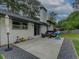 Large backyard with patio area, lush green grass, and mature trees offering ample space for outdoor activities at 2324 Ithica Se Dr, Marietta, GA 30067