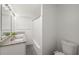 Bathroom featuring granite counters, bright lighting and a shower tub combo at 2324 Ithica Se Dr, Marietta, GA 30067
