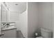 Clean bathroom with a granite sink, and a shower/tub with a shower curtain at 2324 Ithica Se Dr, Marietta, GA 30067