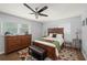 This bedroom features a ceiling fan, area rug, and a large window to allow for natural light at 2324 Ithica Se Dr, Marietta, GA 30067