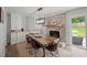 Elegant dining room features custom built-ins, a brick fireplace, and a wooden dining table at 2324 Ithica Se Dr, Marietta, GA 30067