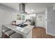 Updated kitchen boasts white cabinets, granite countertops, and stainless steel appliances at 2324 Ithica Se Dr, Marietta, GA 30067