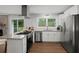 Modern kitchen with stainless steel appliances and a view of the backyard at 2324 Ithica Se Dr, Marietta, GA 30067