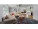 Bright living room showcases a comfortable sectional, decorative rug, and open floor plan at 2324 Ithica Se Dr, Marietta, GA 30067