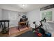 Well-lit office and workout room featuring a desk and a full gym setup at 2324 Ithica Se Dr, Marietta, GA 30067