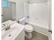 Clean bathroom with white fixtures, tile flooring, and a shower-tub combo for relaxation at 2492 Wild Rose Cir, Lawrenceville, GA 30044