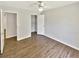 Bedroom featuring wood-look flooring, closet and ceiling fan at 2492 Wild Rose Cir, Lawrenceville, GA 30044