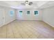 Bonus room features tiled floor, ceiling fan and multiple windows at 2492 Wild Rose Cir, Lawrenceville, GA 30044