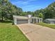 Charming home with garage, inviting porch, and a lush green lawn at 2492 Wild Rose Cir, Lawrenceville, GA 30044