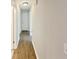 Hallway featuring wood-look flooring and neutral paint at 2492 Wild Rose Cir, Lawrenceville, GA 30044
