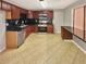 Functional kitchen with dark countertops, stainless steel appliances, and tiled floors at 2492 Wild Rose Cir, Lawrenceville, GA 30044