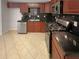 Modern kitchen with stainless steel appliances and dark granite countertops at 2492 Wild Rose Cir, Lawrenceville, GA 30044
